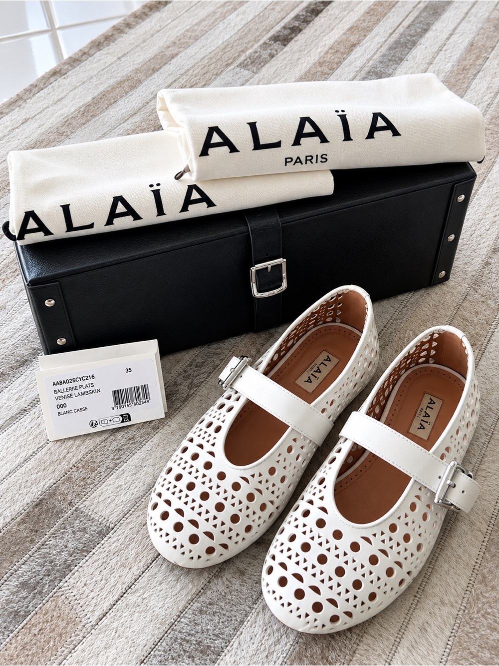Alaia White Laser-Cut Mary Jane Moccasins
